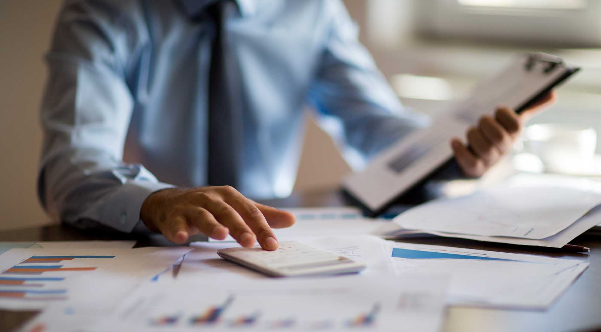 Business owner reviewing sale-leaseback benefits with Wangard Partners